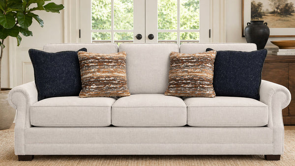 White sofa with decorative pillows in a living room setting