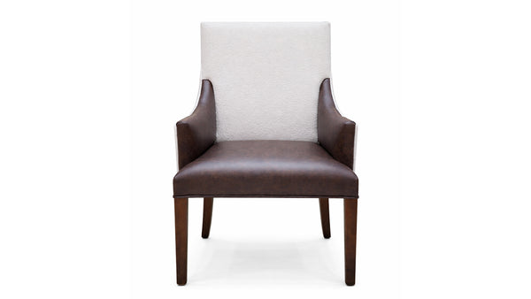 Chair with white cushioned backrest and brown leather seat and armrests on a white background