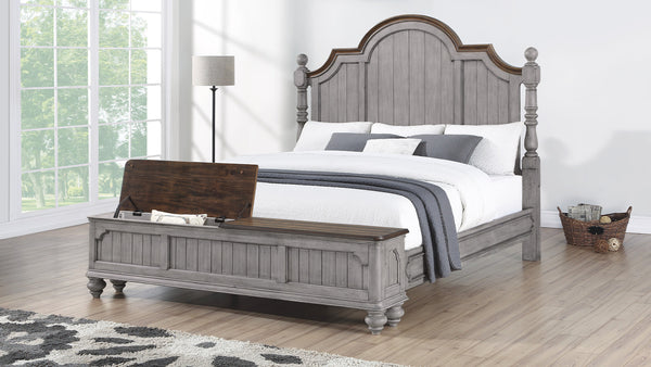 Bedroom with a wooden bed and bench in a well-lit room.