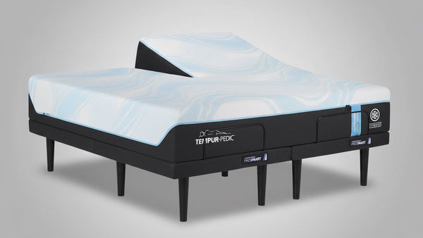 Cama ajustable Teilipur-Pedic con colchón azul sobre fondo blanco