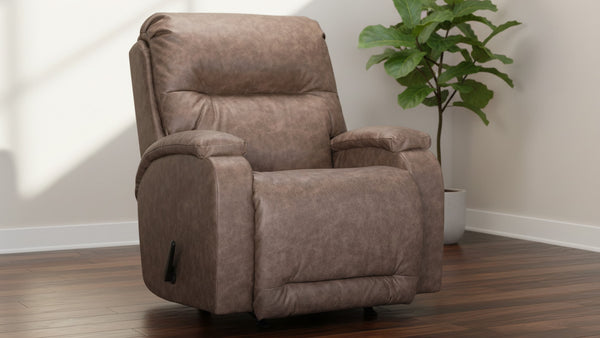 Sillón reclinable marrón en una habitación con una planta.