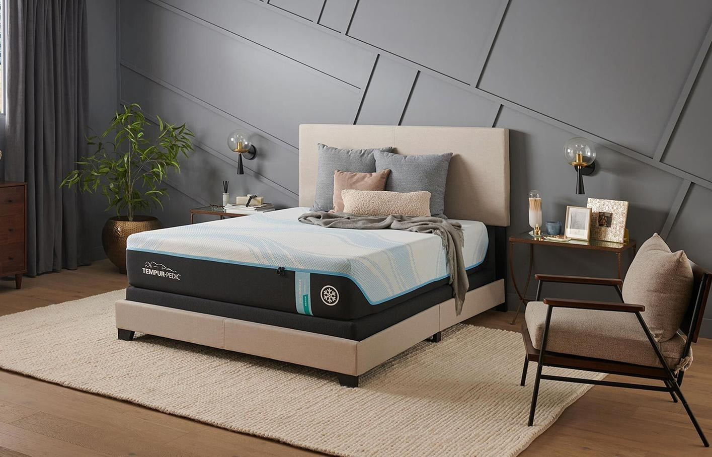 Bed with mattress displayed in a bedroom setting