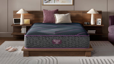 Mattress on a bed in a bedroom setting with decor elements.