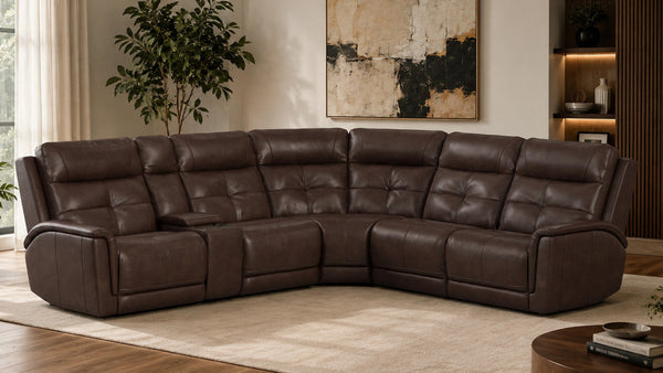 Brown leather sectional sofa in a living room setting with a painting and plants.