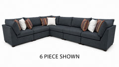 A 6-piece dark gray fabric sectional sofa with multiple throw pillows, shown on a white background with the text '6 PIECE SHOWN' below.