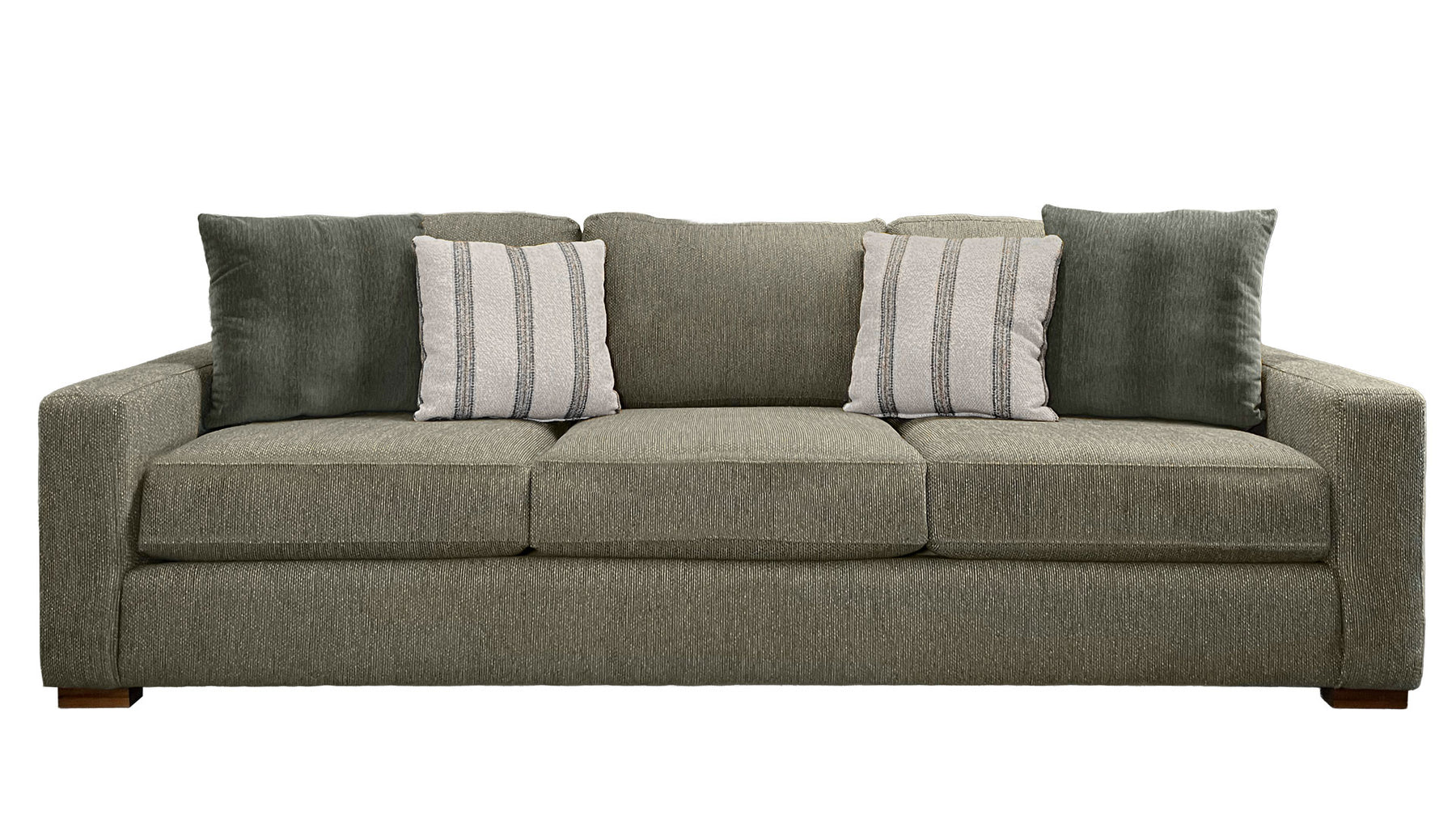 Green sofa with patterned pillows on a white background