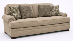 Beige sofa with patterned cushions on a white background