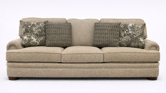 Beige sofa with patterned cushions on a white background