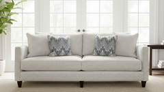 Gray sofa with patterned cushions in a bright room