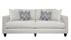 Gray sofa with patterned cushions on a white background