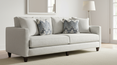 Gray sofa with patterned cushions in a living room setting