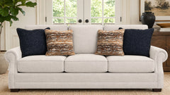 White sofa with decorative pillows in a living room setting