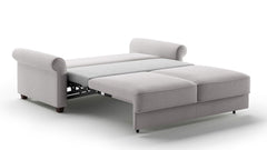 Gray sectional sofa with pull-out bed on a white background
