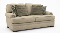 Beige sofa with patterned cushions on a white background
