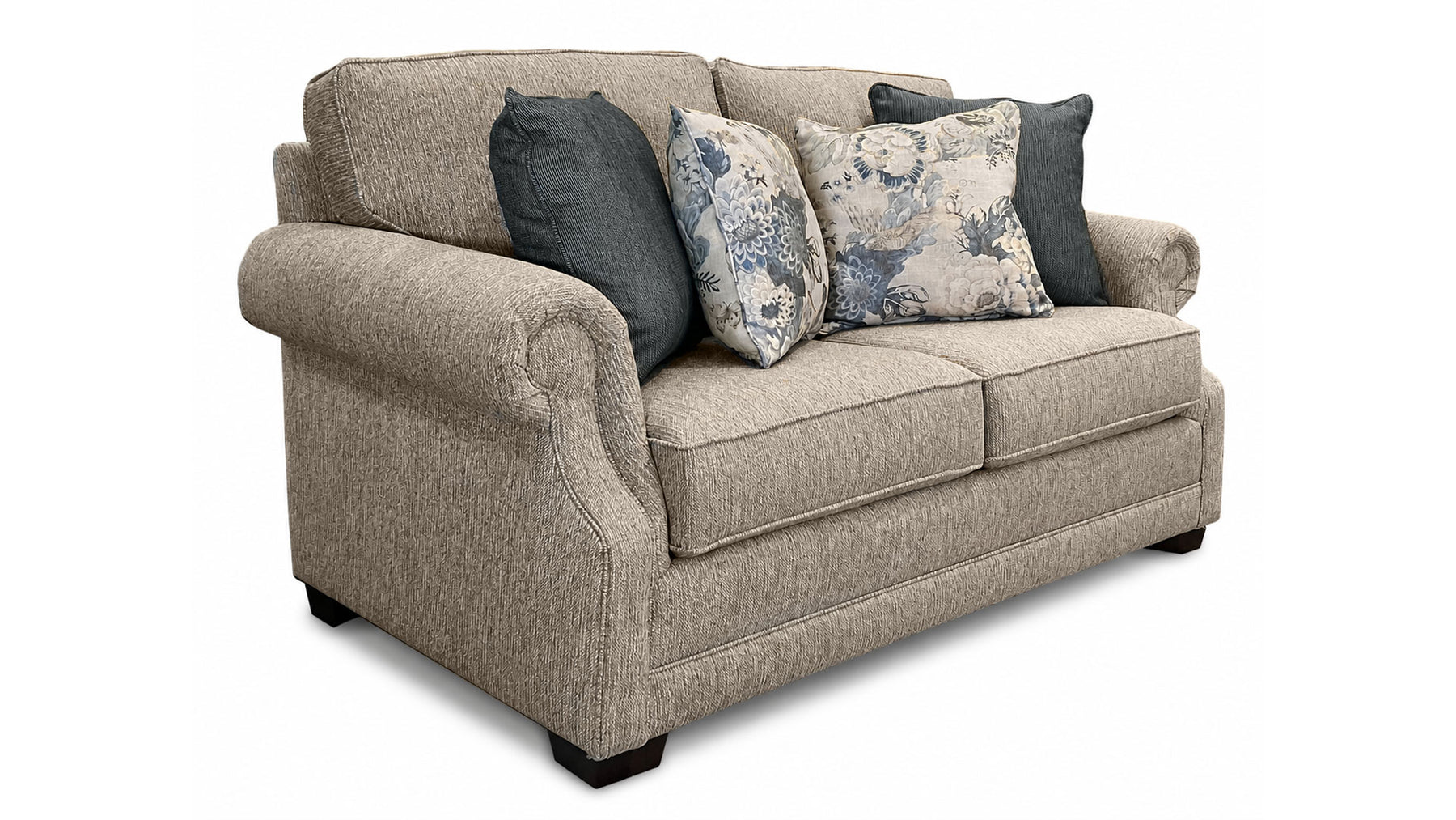 Beige sofa with decorative pillows on a white background