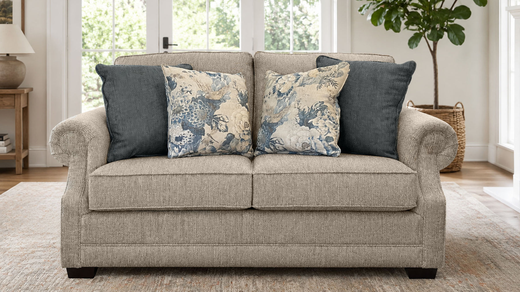 Beige sofa with decorative pillows in a living room setting