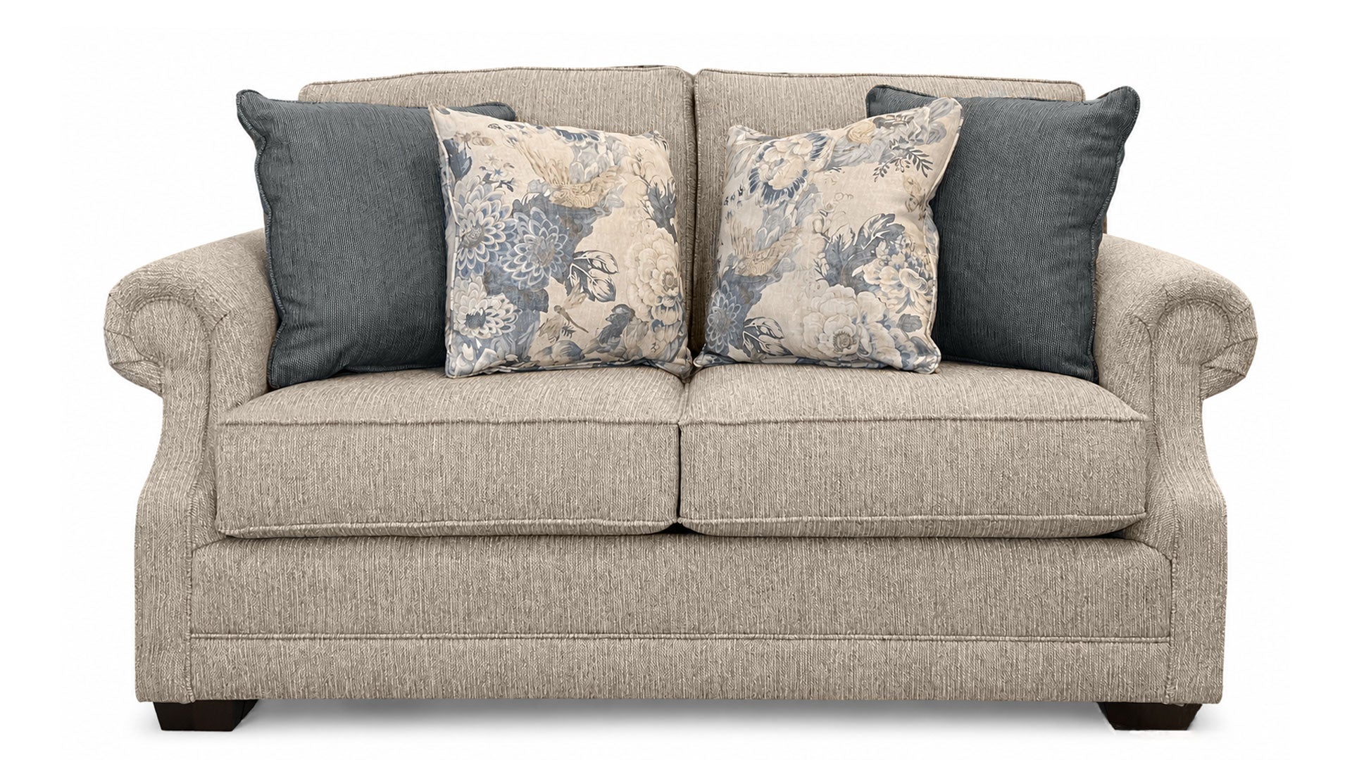 Beige sofa with patterned and solid color cushions on a white background