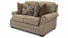 Brown sofa with patterned cushions on a white background