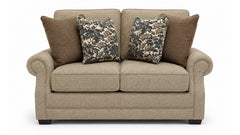 Beige sofa with patterned and solid color cushions on a white background