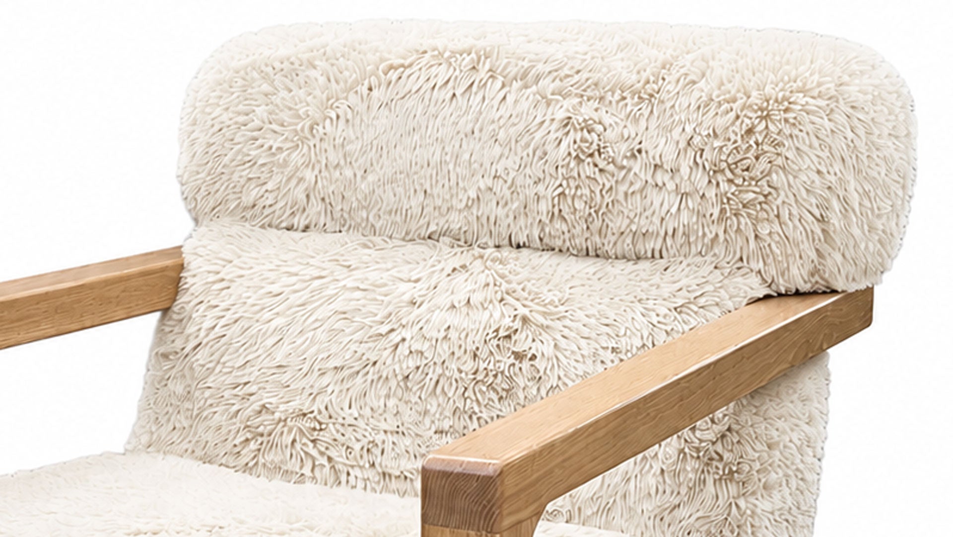 Close-up of a plush cream faux-shearling upholstered armchair with light natural wood arms on a white background.