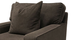 A close-up of a dark brown upholstered armchair with a matching square throw pillow, shown against a plain white background.