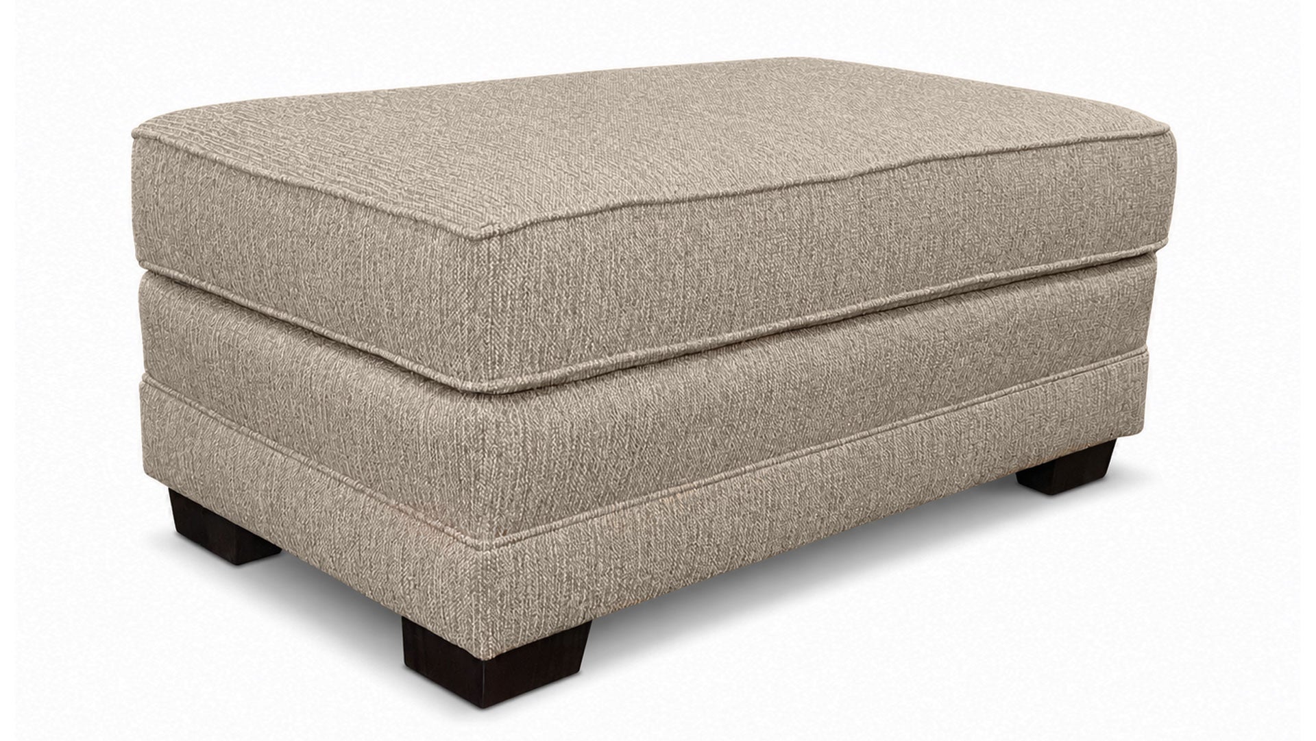 Beige ottoman with a textured surface on a white background
