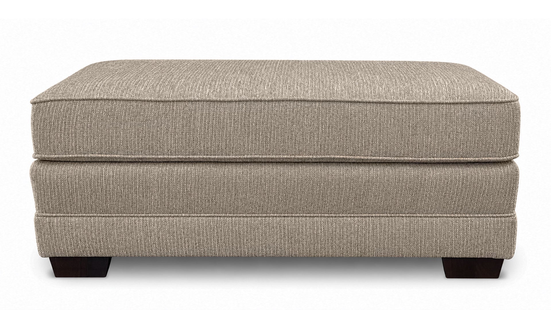 Beige ottoman with a textured surface on a white background