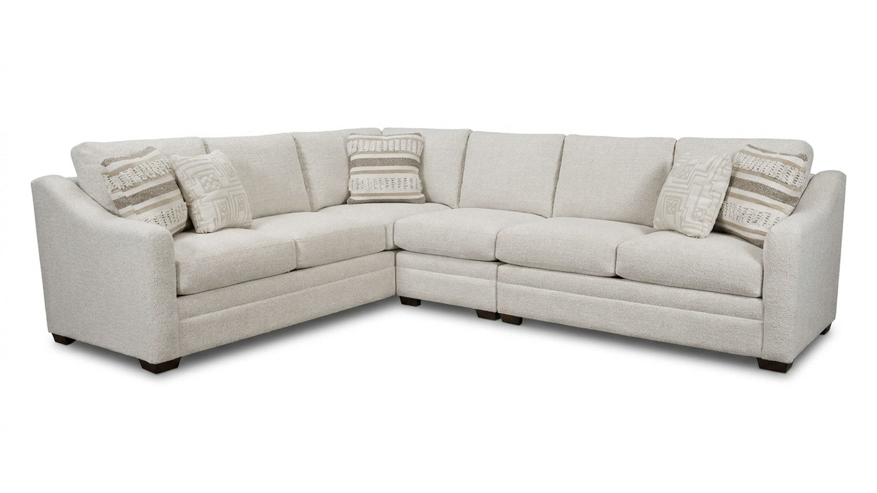 Beige sectional sofa with cushions on a white background