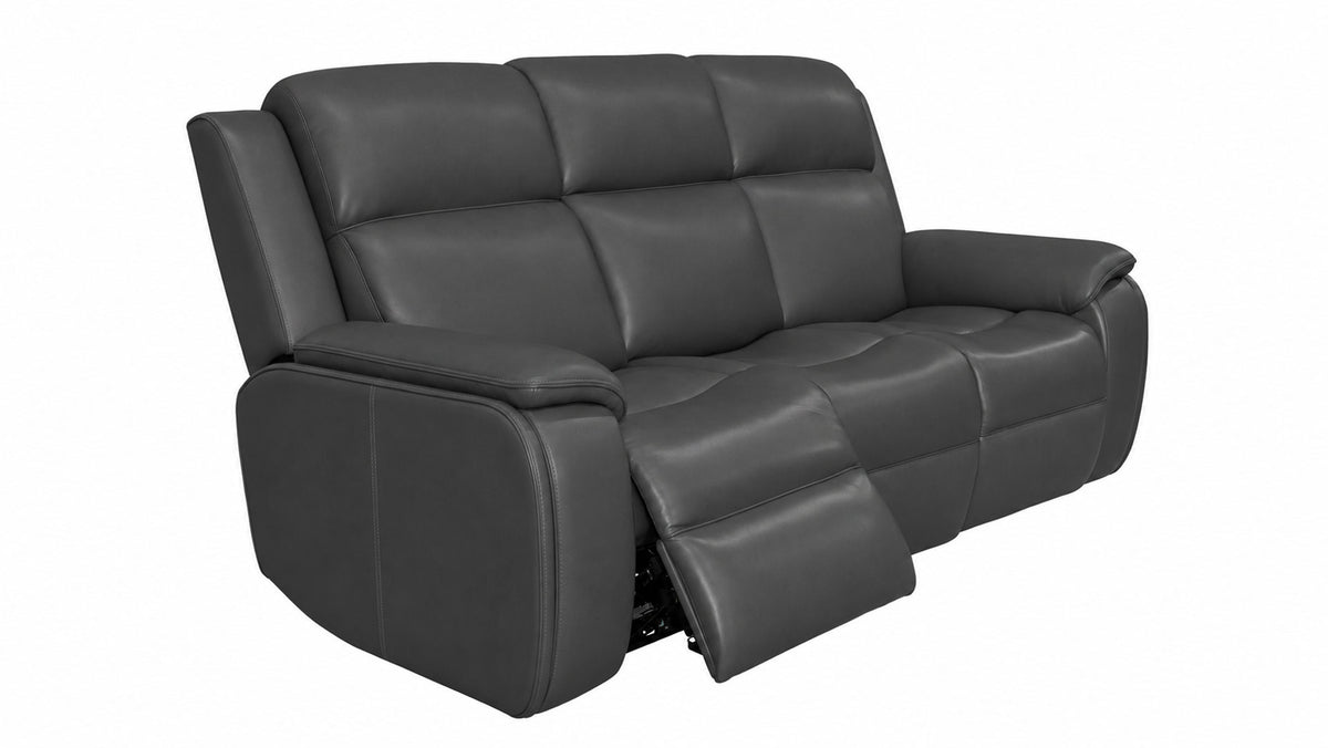 A dark gray leather reclining loveseat sofa with the right footrest extended, shown against a plain white background.