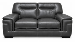 A black leather loveseat sofa with two seat cushions, two back cushions, wide armrests, and a low block base, shown against a plain white background.
