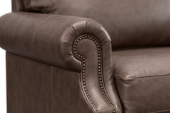 Brown leather armchair on a white background