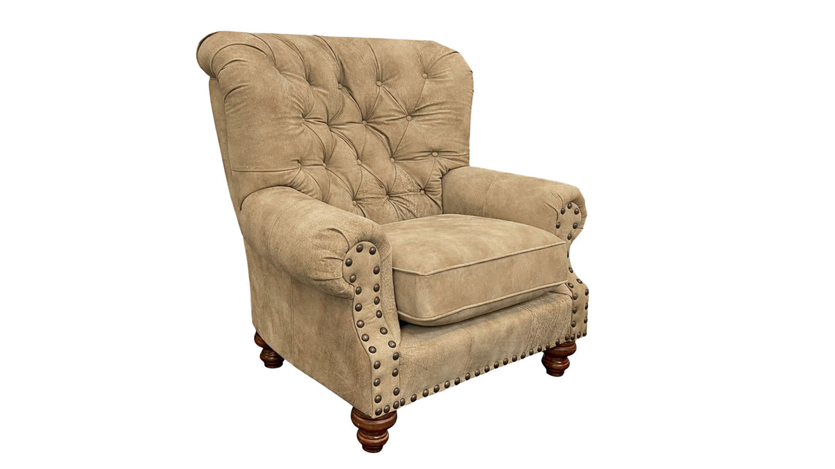 Beige armchair with tufted backrest and nailhead trim on a white background