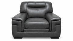 A dark gray leather armchair with deep button tufting on the backrest and seat, shown from a front-facing perspective against a plain white background.