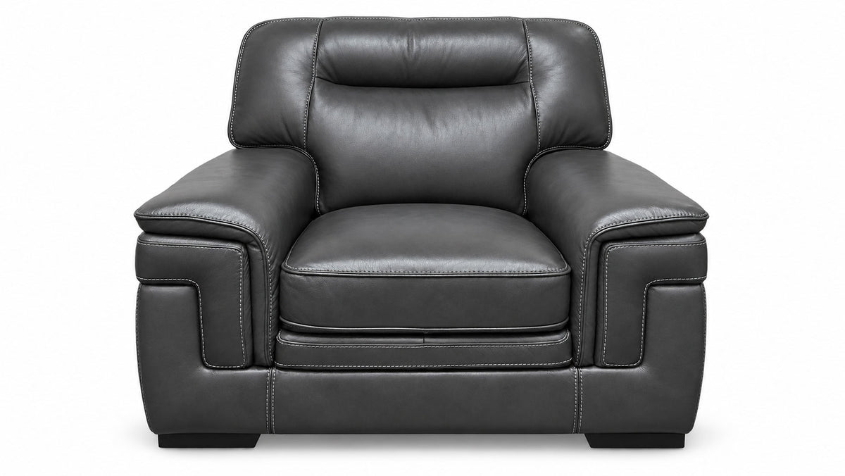 A dark gray leather armchair with deep button tufting on the backrest and seat, shown from a front-facing perspective against a plain white background.