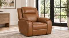 A brown leather recliner chair shown in a modern living room setting with a light-colored rug, a wooden side table, and large black-framed glass doors in the background.