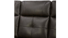 Close-up of a dark brown leather sofa with visible stitching on a white background