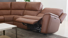 Big Spring saddle brown leather sectional with power recliners in modern living room setting
