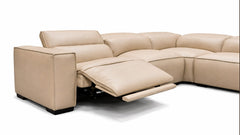 Beige sectional sofa with reclining feature on a white background