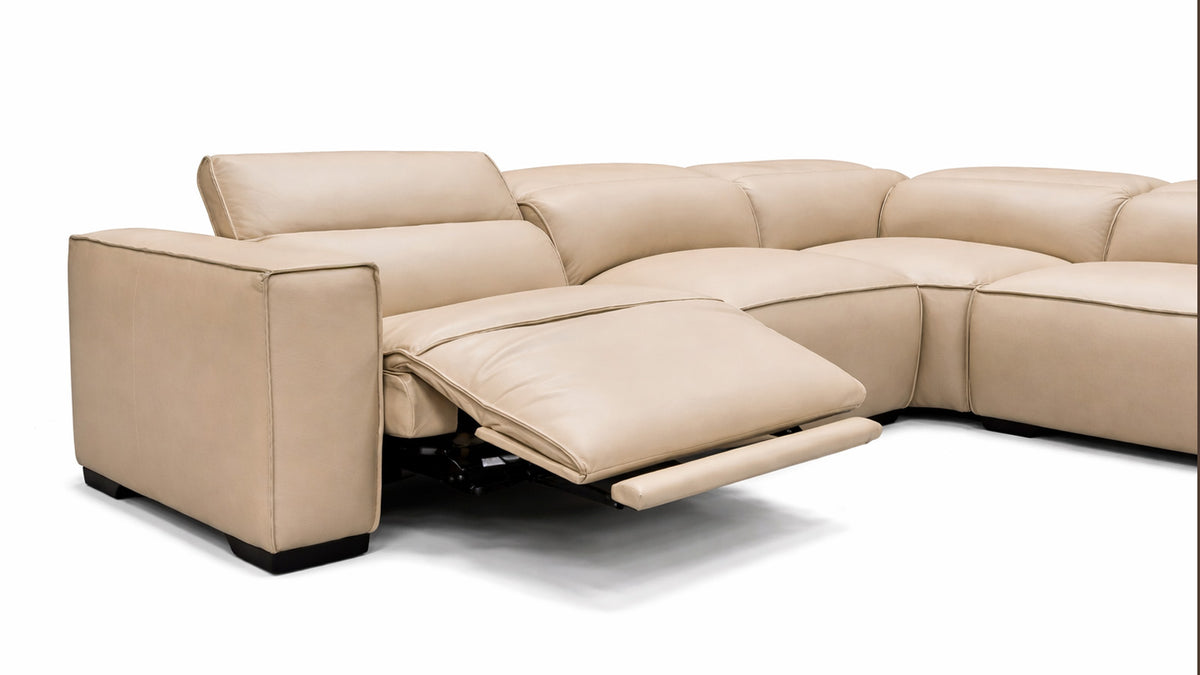 Beige sectional sofa with reclining feature on a white background