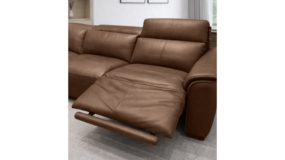 Brown leather sectional sofa in a room setting
