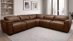 Brown leather sectional sofa in a living room setting with decor elements.