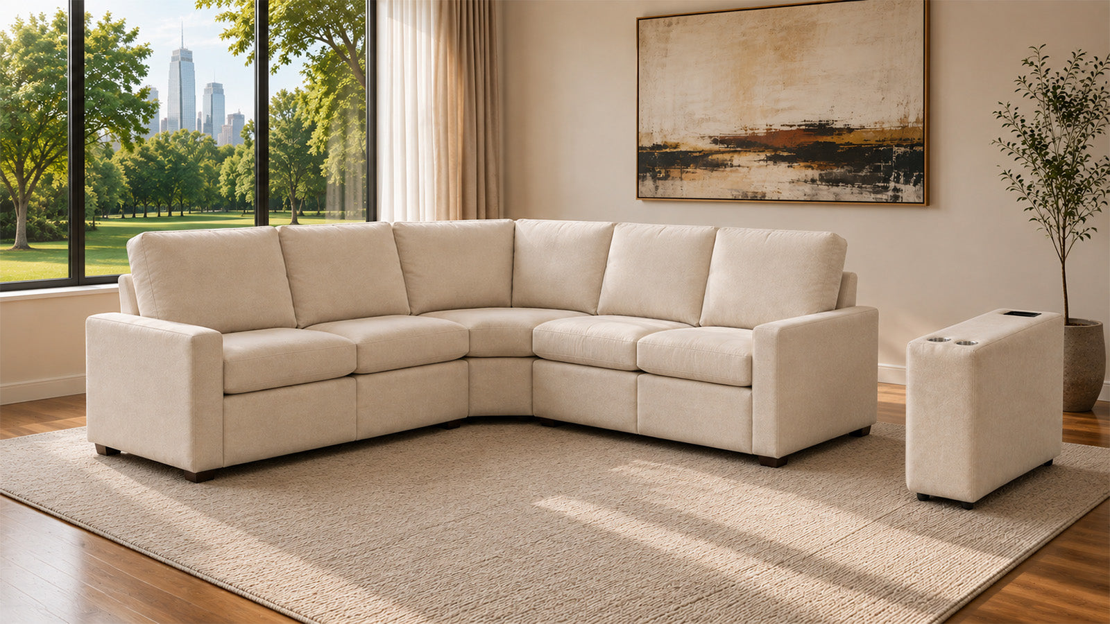 A light beige sectional sofa with matching ottoman in a modern living room setting with a large window, city view, and abstract wall art.