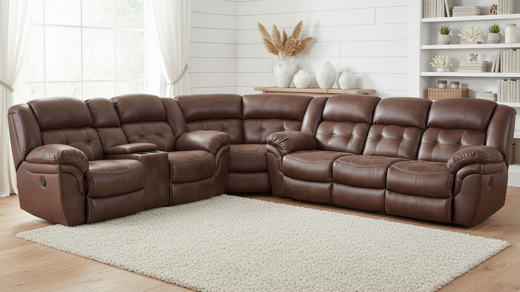 Brown reclining sectional sofa in a living room setting with white walls and decor.