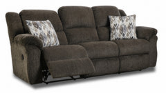 Brown reclining sofa with patterned cushions on a white background