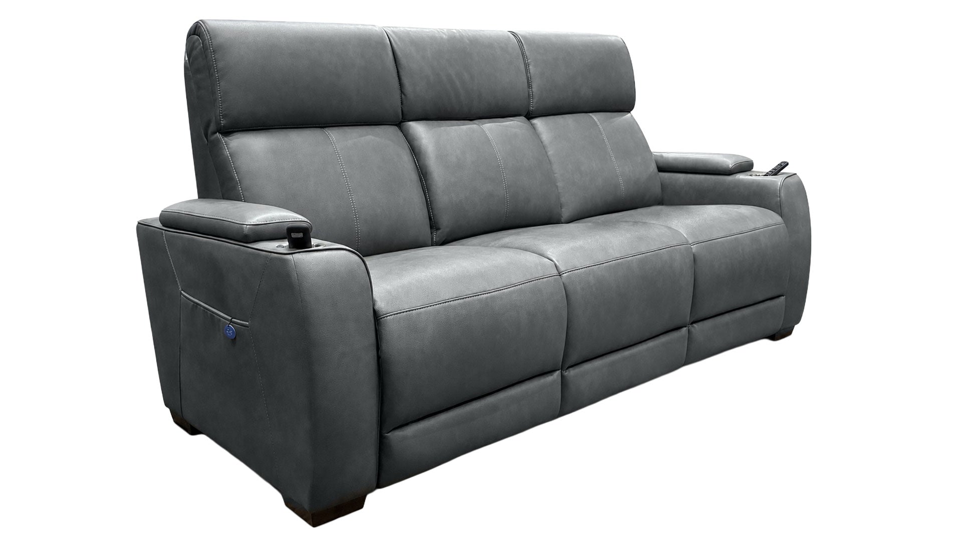 A dark gray leather reclining sofa with a high back, padded armrests, and built-in media outlets on the outer sides, shown against a plain white background.