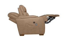A tan power recliner chair shown in a side profile with the footrest extended, isolated on a white background.