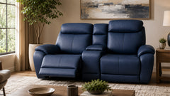 Blue leather reclining sofa in a living room setting with decor elements.