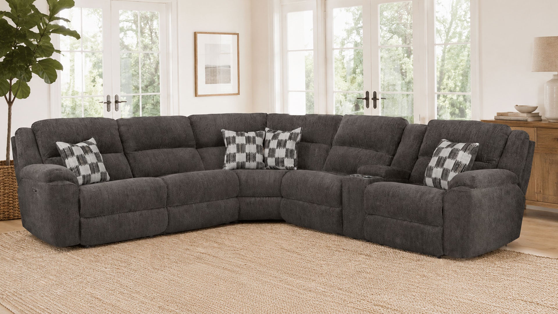 Gray sectional sofa with checkered pillows in a living room setting.