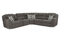 Gray sectional sofa with patterned cushions on a white background
