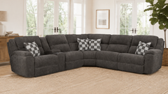 Gray sectional sofa with checkered pillows in a living room setting.